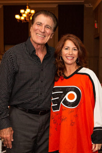 Philadelphia Eagles player Vince Papale with Mollie Plotkin in a Philadelphia Flyers Jersey