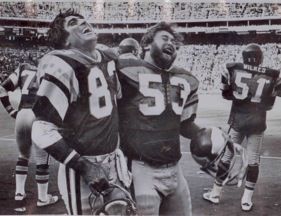 Vince Papale with the Philadelphia Eagles, smiling and laughing with his teammate.