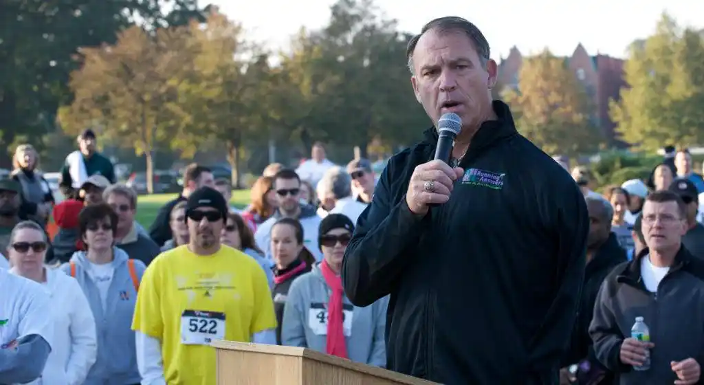 Kevin Reilly at a podium speaking.