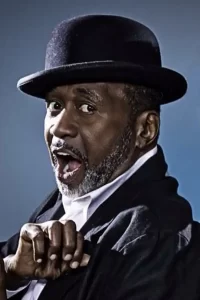 Ben Vereen wearing a suit and fedora
