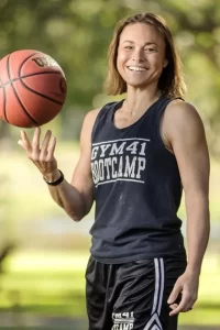 WNBA Player Tully Bevilaqua holding a basketball.