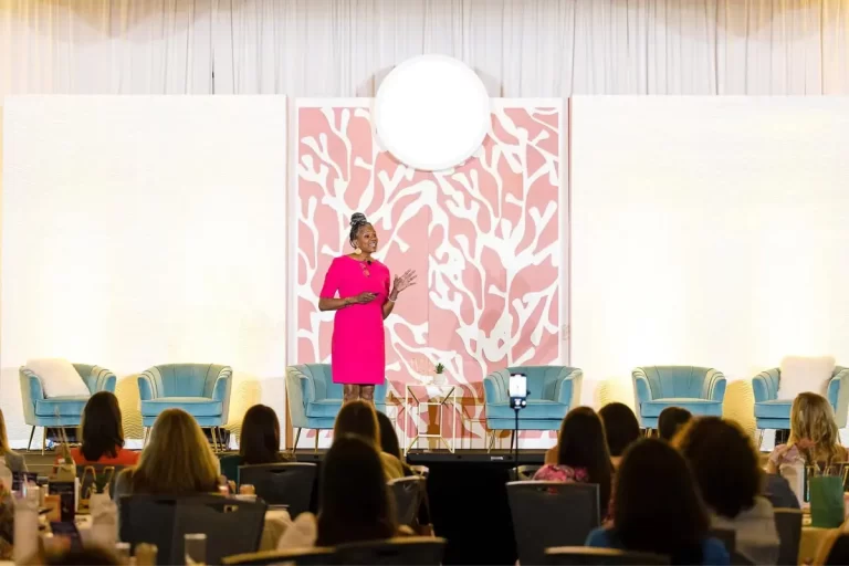 Diversity and Inclusion Speaker Leslie Maxie at the Women in Retail Summit giving a speech.