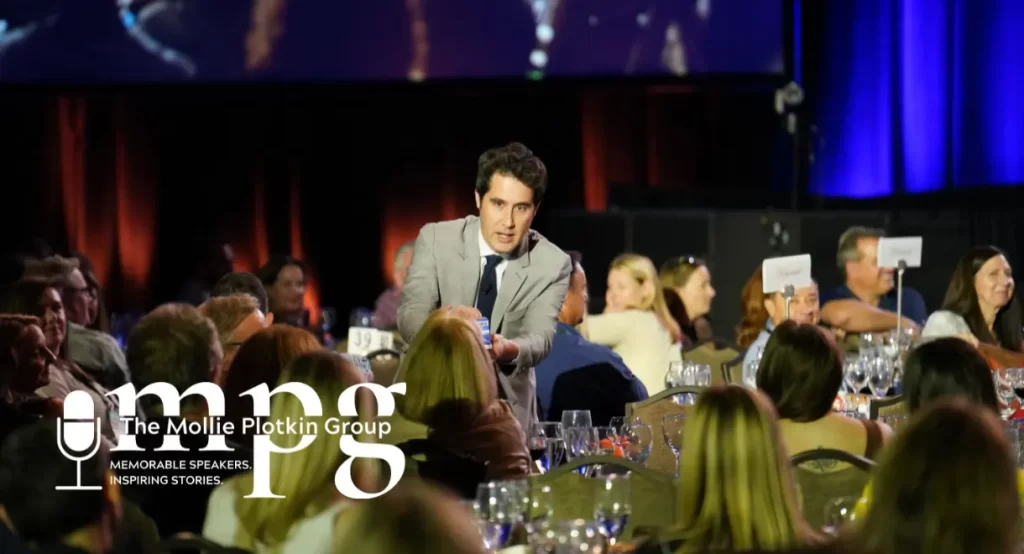 Corporate Magician David Kwong performs among the audience's tables.