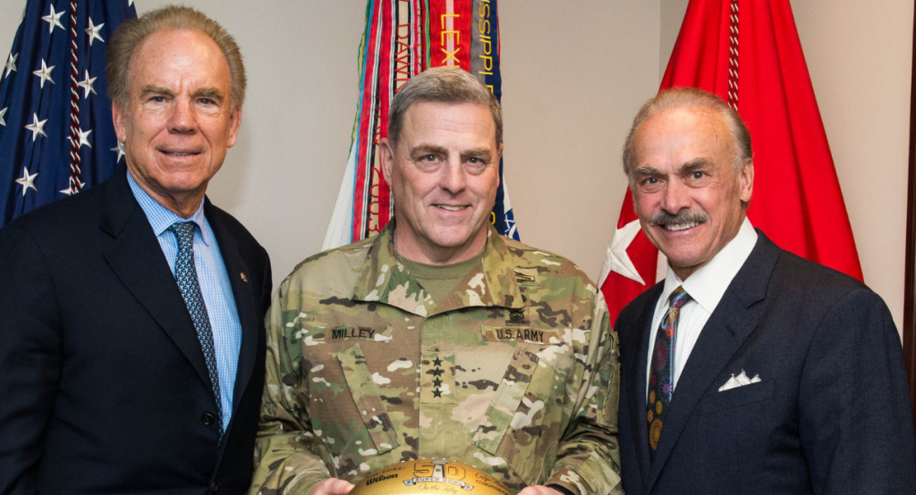 Rocky Bleier next to two men, one in a military uniform.