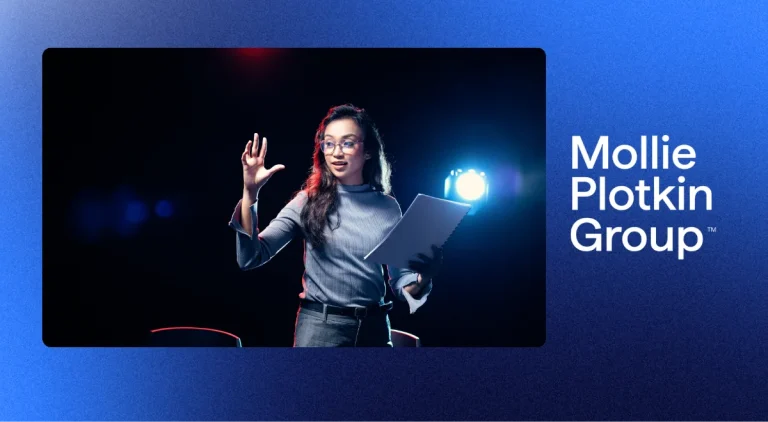 a woman giving a stage introduction
